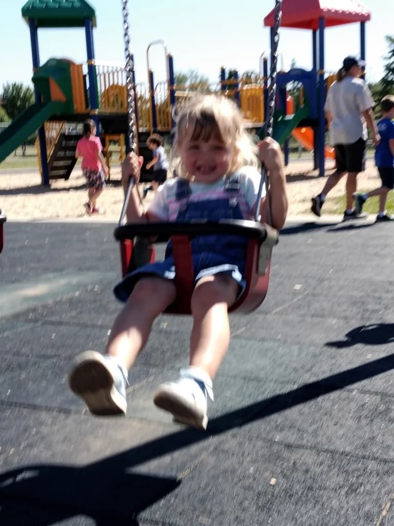 Before: a child on a playground, a phone snapshot
